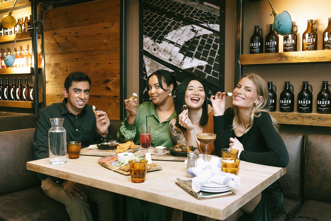 Friends sharing plates at a tasting